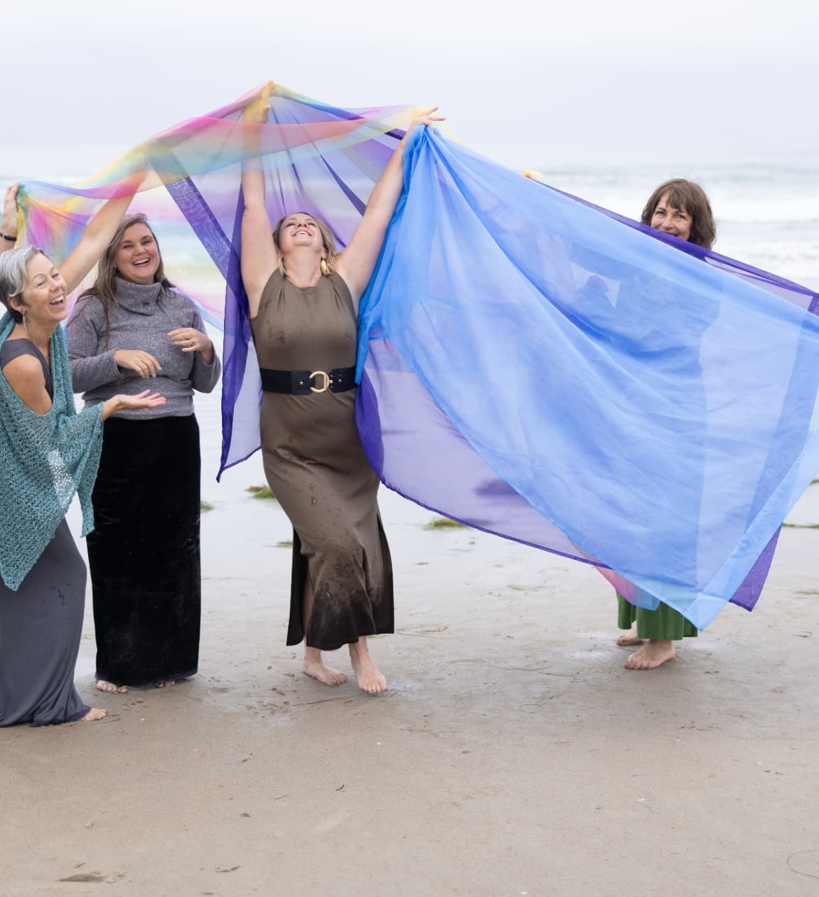 D. LeD dancing with a flowing silk scarf on the beach